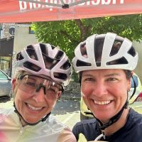 2 women cyclists, feed stop cocktails